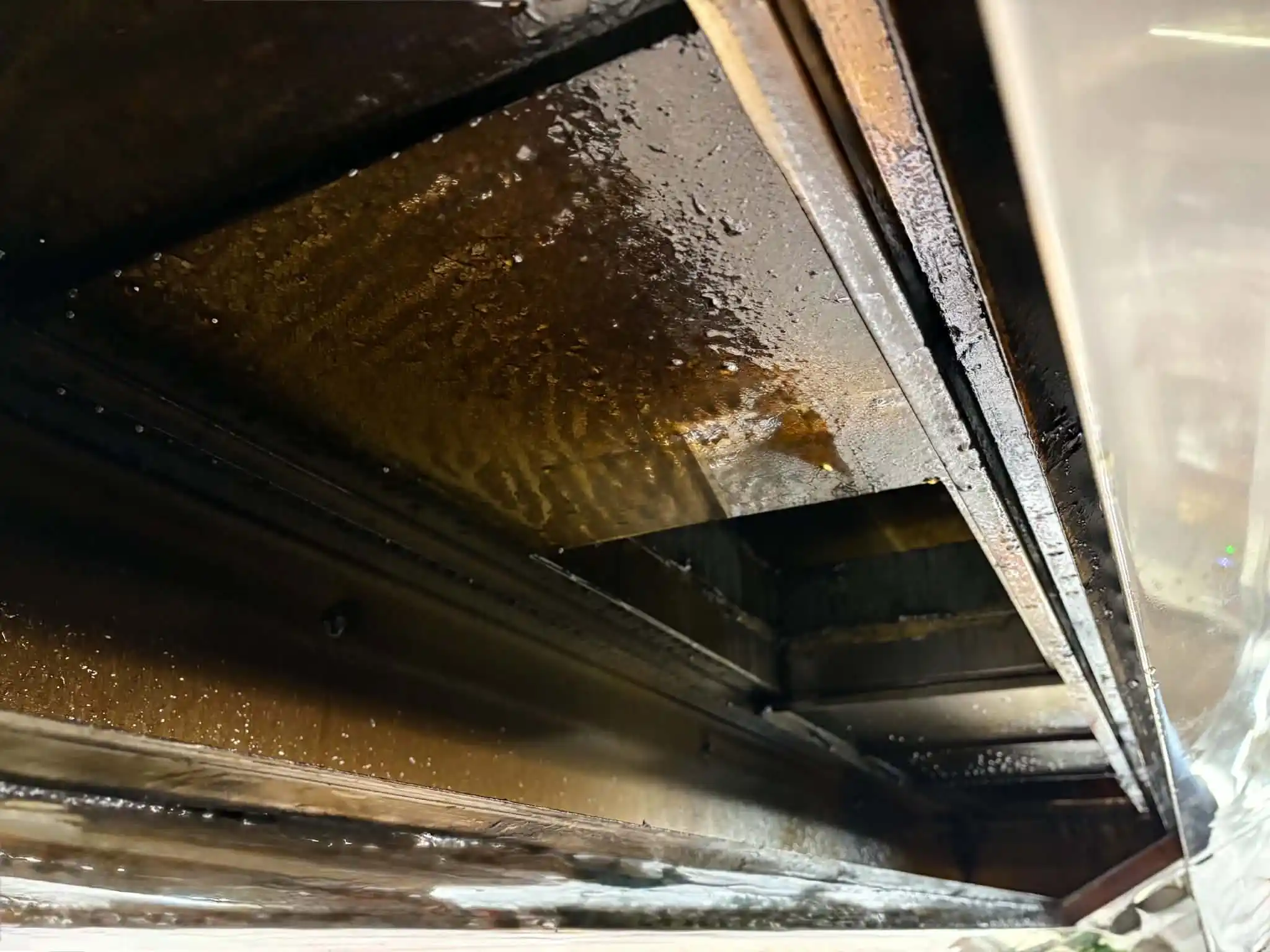 Grease build-up inside exhaust channel before cleaning