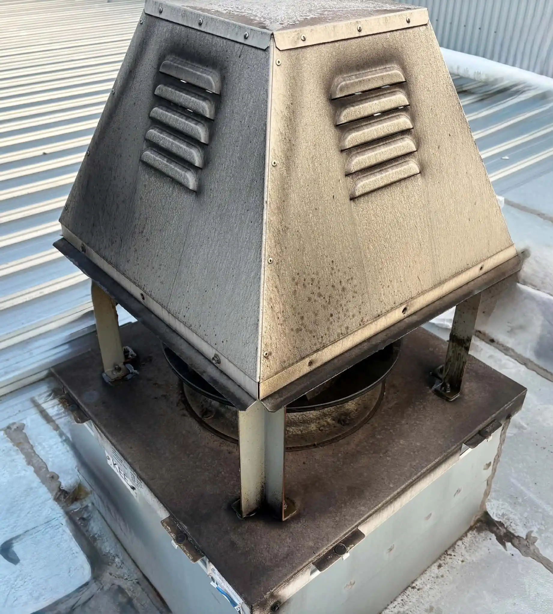 Rooftop exhaust fan housing before cleaning